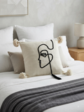Housse de coussin visage de profil one line brodé ivoire et noir — pompons artisanat marocain fait main