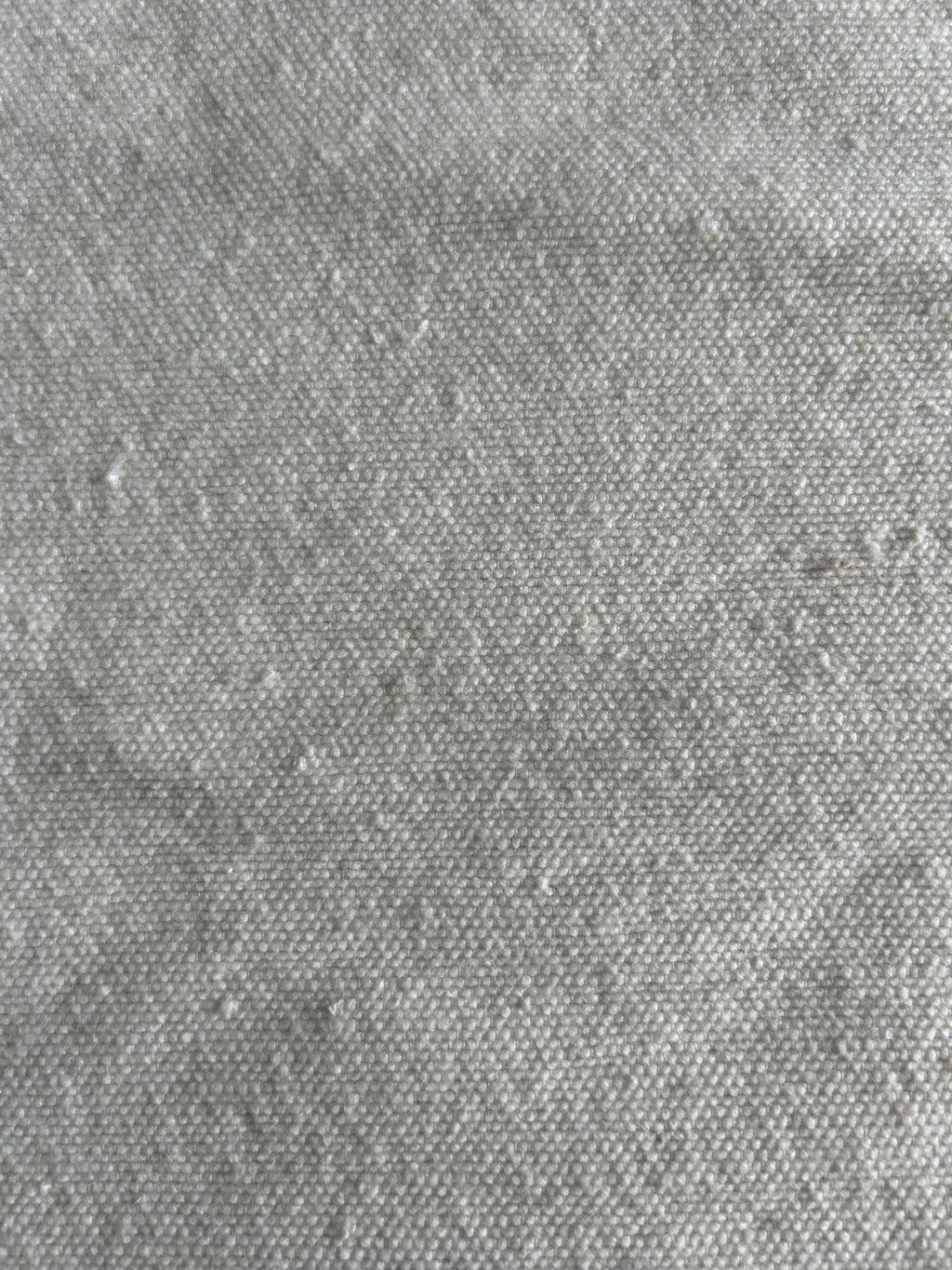 Gros plan texture coton naturel tissé à la main – Matière douce et légèrement gaufrée, housse de coussin éc