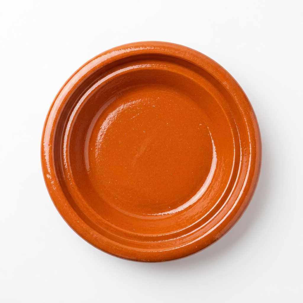 Plat du tajine marocain sans couvercle, avec intérieur brillant, vu de dessus